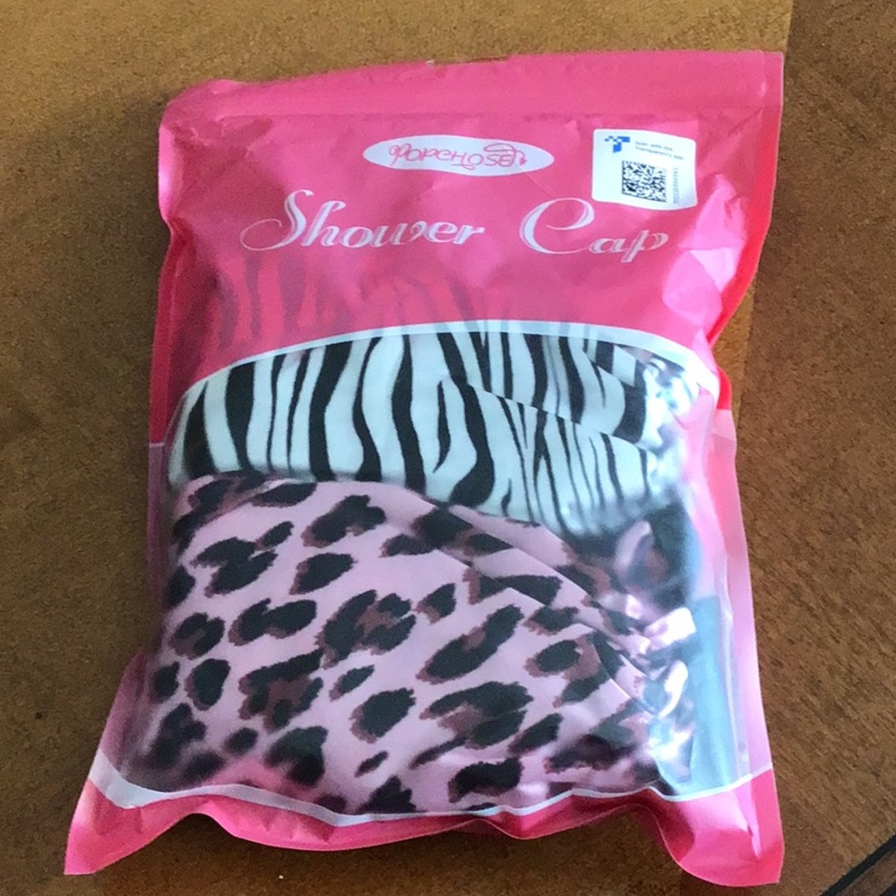 Two brand new shower caps